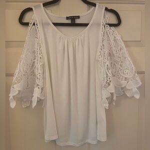 Cold Shoulder pullover top with beautiful cutout sleeves.Fabric-Viscose/Spandex